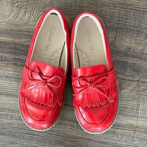 Shiny red loafers